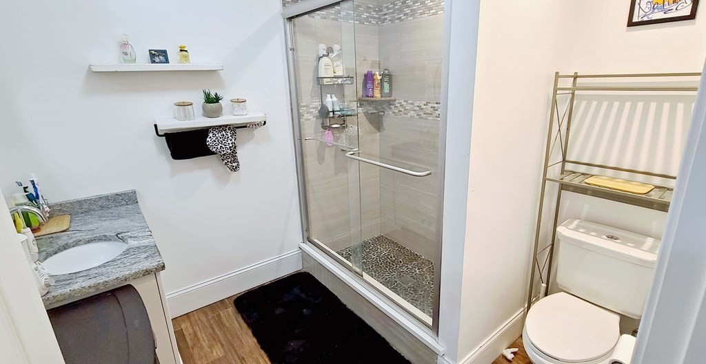 6 Sylvan Road Holbrook, MA 02343 - Photo 14 of 24 a bathroom with a sink toilet and shower