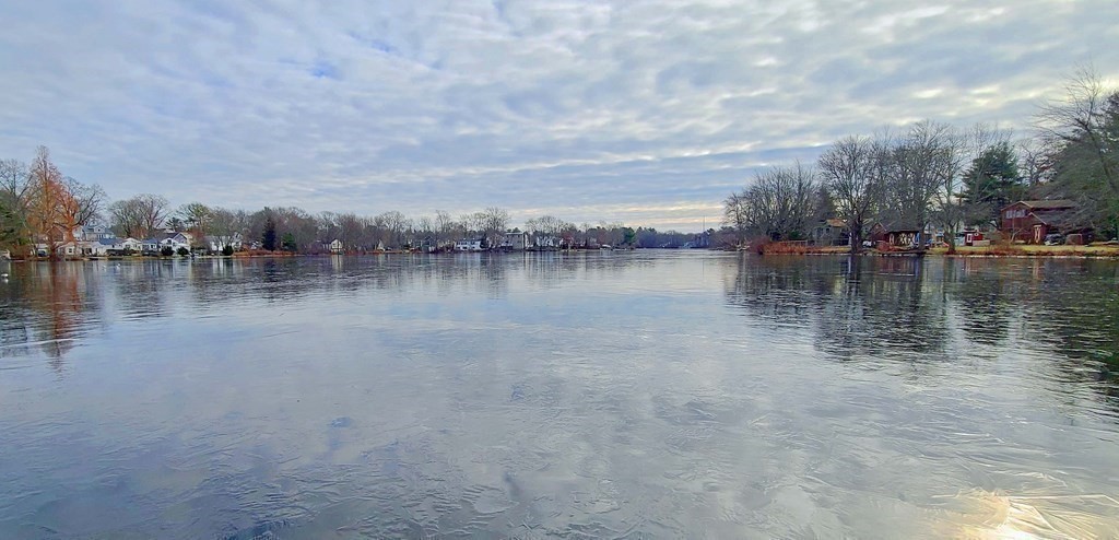 6 Sylvan Road Holbrook, MA 02343 - Photo 23 of 24 a view of a lake with houses in the back