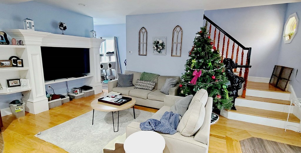 6 Sylvan Road Holbrook, MA 02343 - Photo 7 of 24 a living room with furniture and a flat screen tv