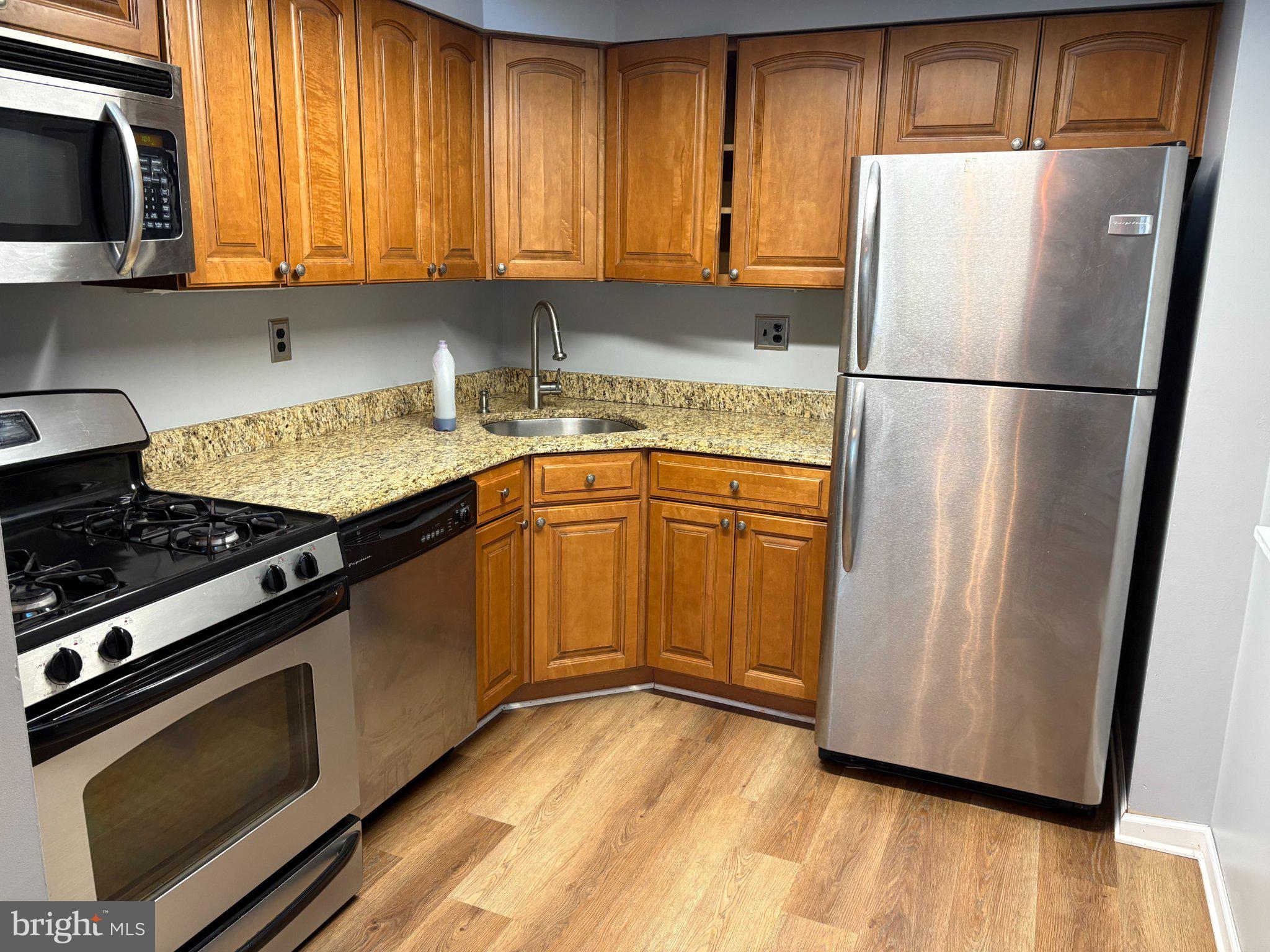 9538 State Rd., Unit B Philadelphia, PA 19114 - Photo 5 of 32 Modern kitchen with warm wood tones.