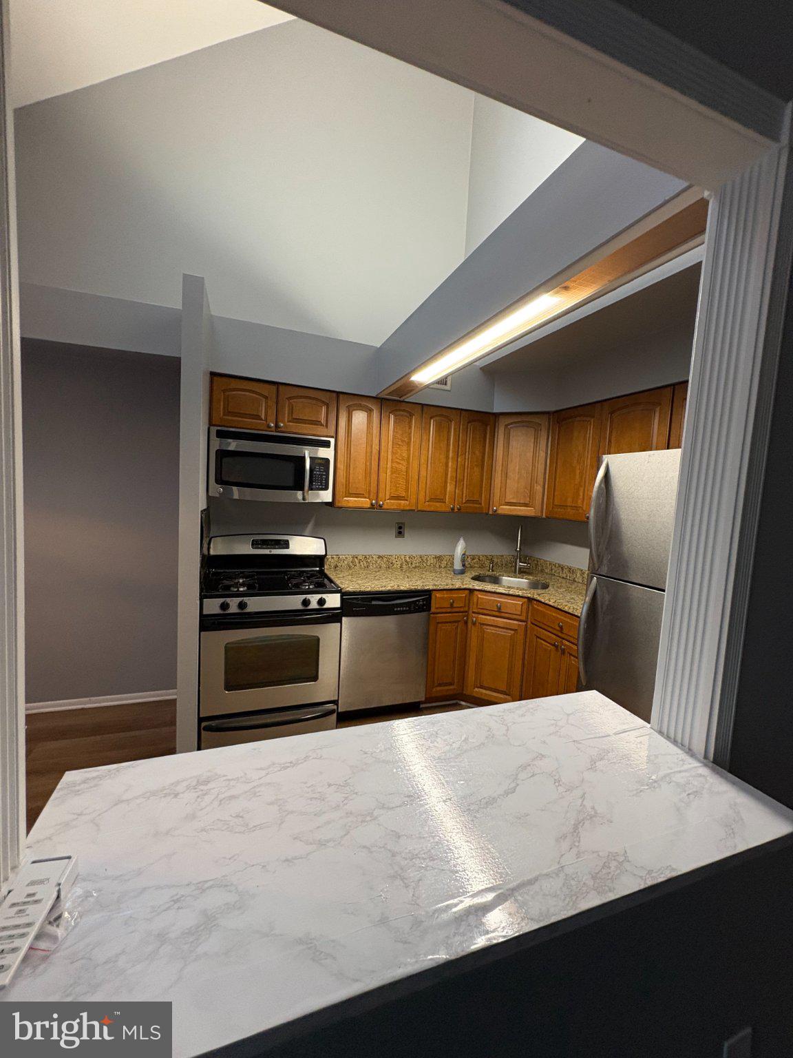 9538 State Rd., Unit B Philadelphia, PA 19114 - Photo 8 of 32 Modern kitchen with vaulted ceiling.