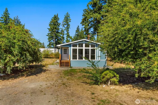 a house with trees in the background