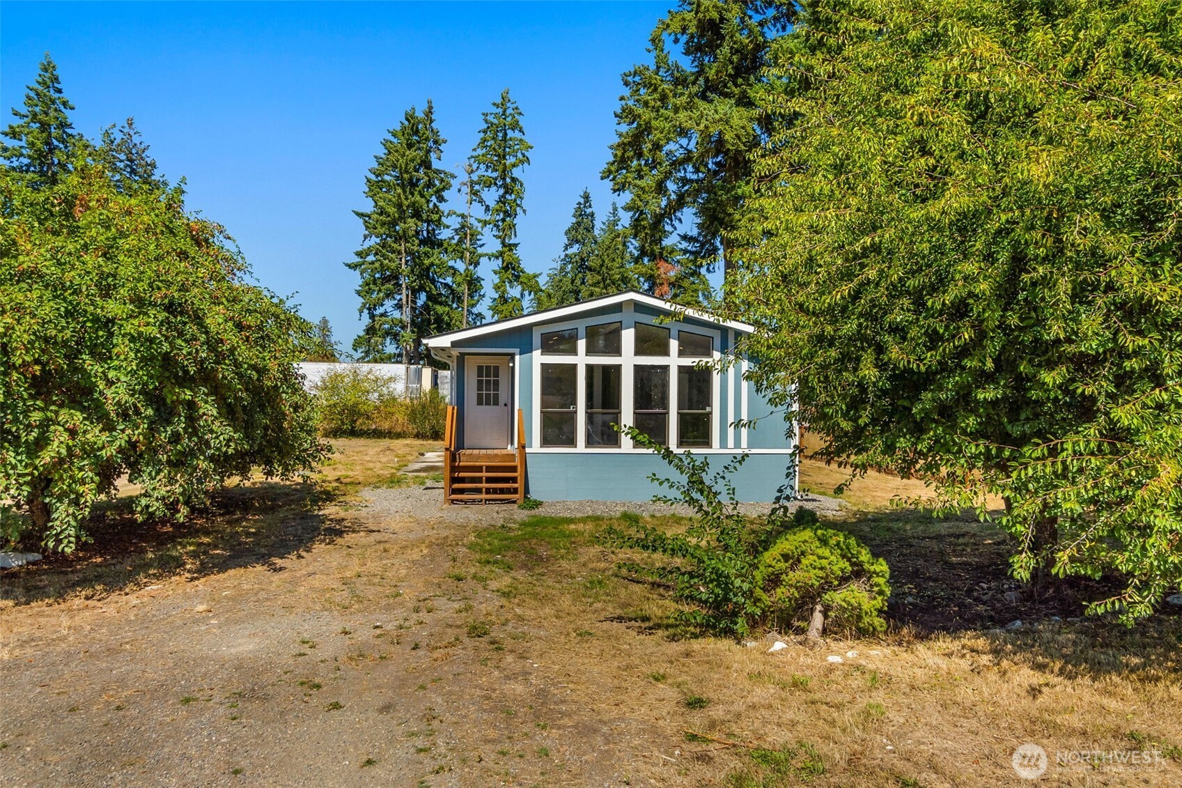 a house with trees in the background