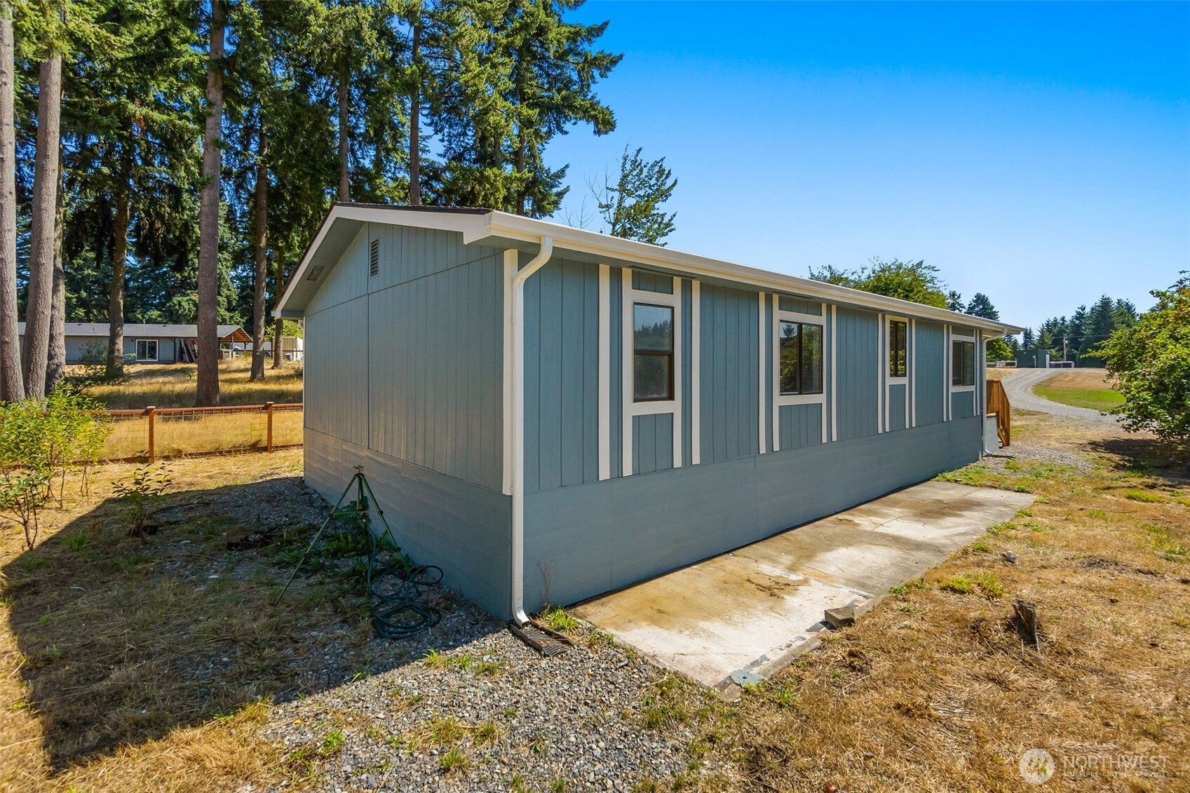 7140 191st Avenue Southwest, Unit 26 Rochester, WA 98579 - Photo 17 of 18 a front view of house with yard