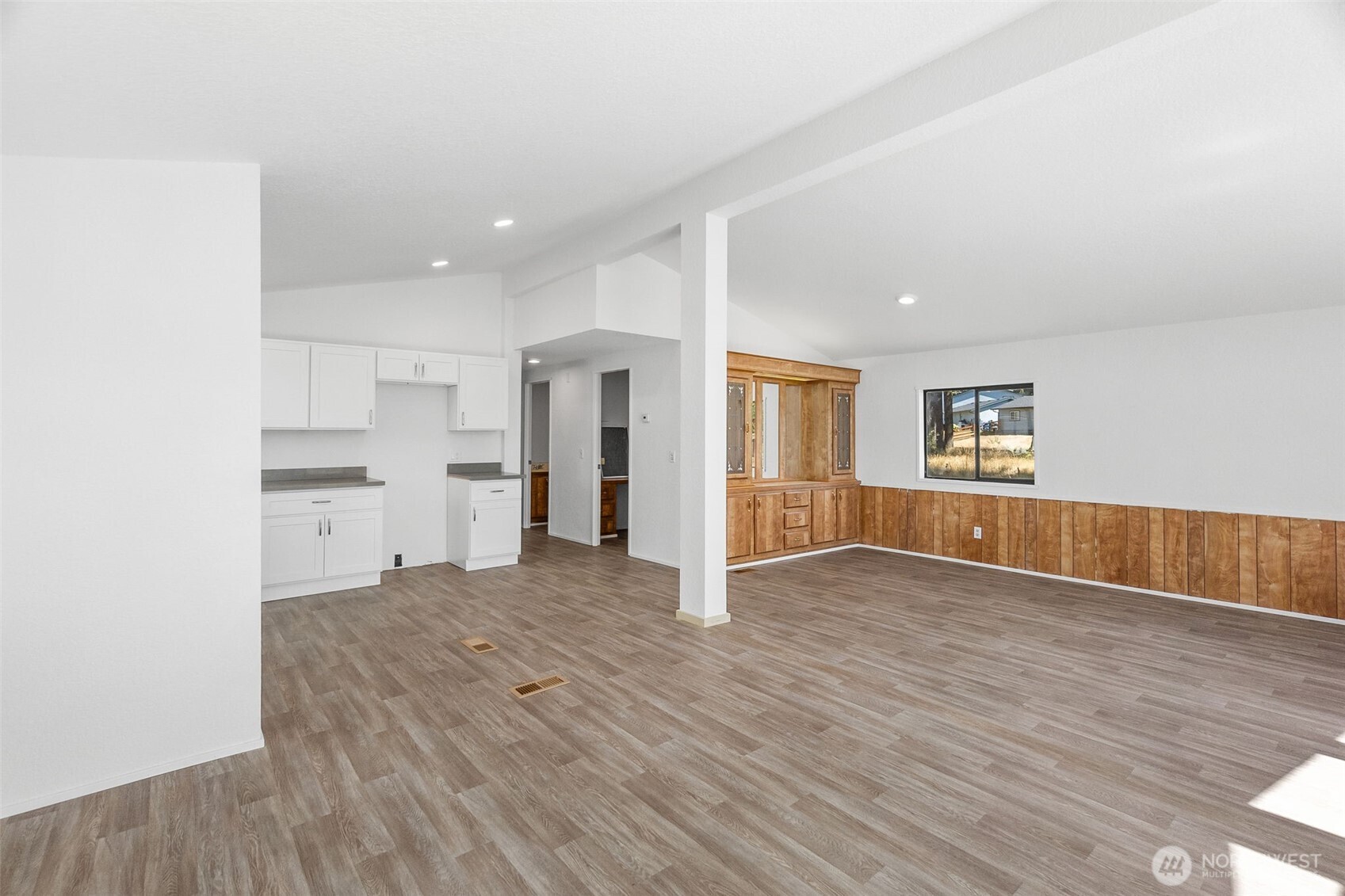 7140 191st Avenue Southwest, Unit 26 Rochester, WA 98579 - Photo 4 of 18 a view of an empty room with a kitchen
