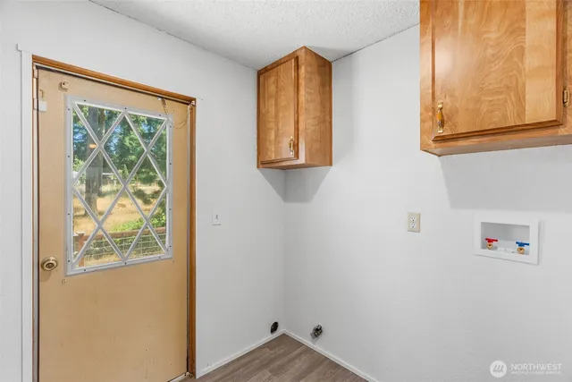 a view of kitchen with wooden floor and window