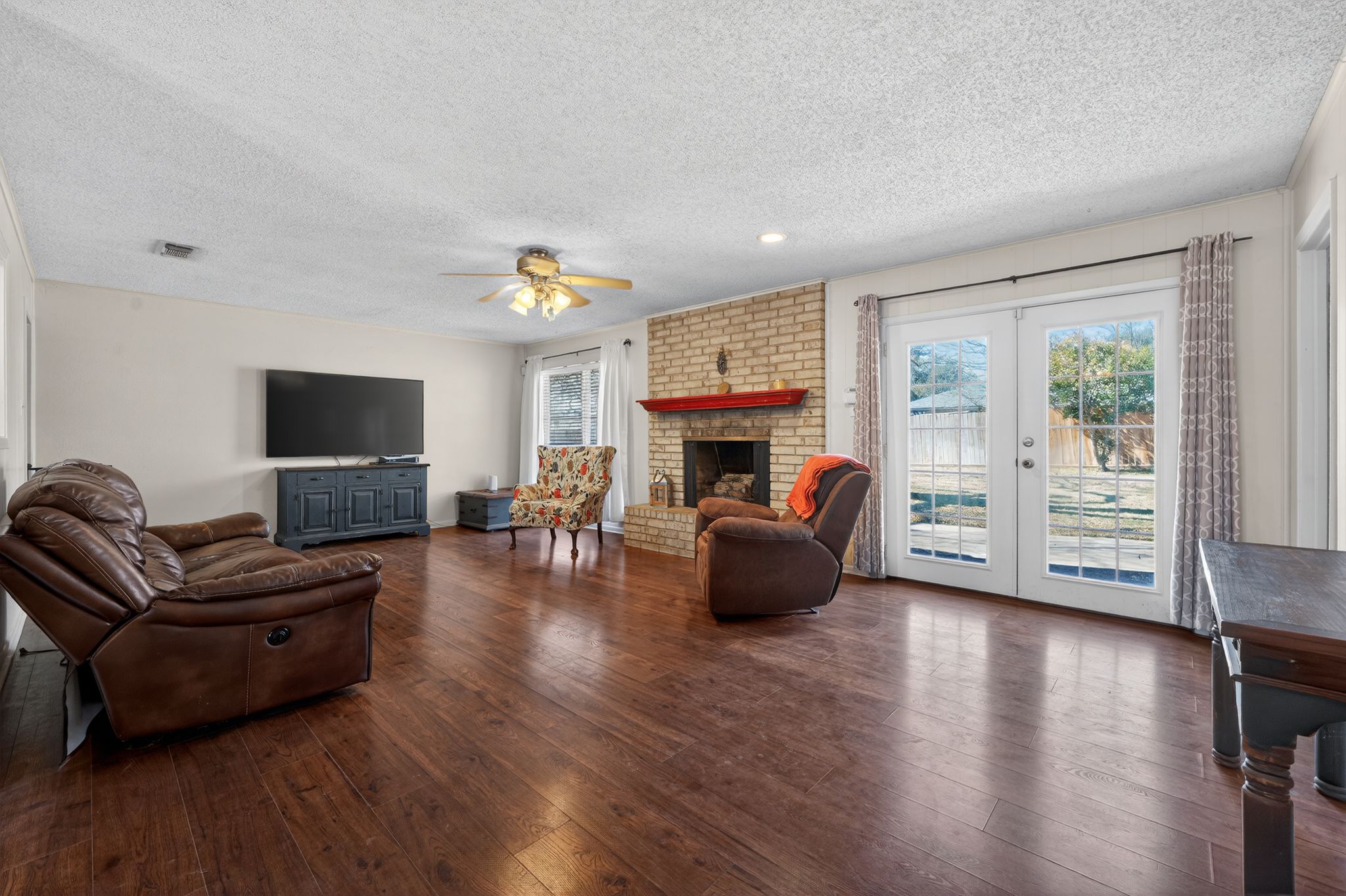 4610 Walnut Road Temple, TX 76502 - Photo 3 of 19 Wood burning fireplace and french doors to the back patio.