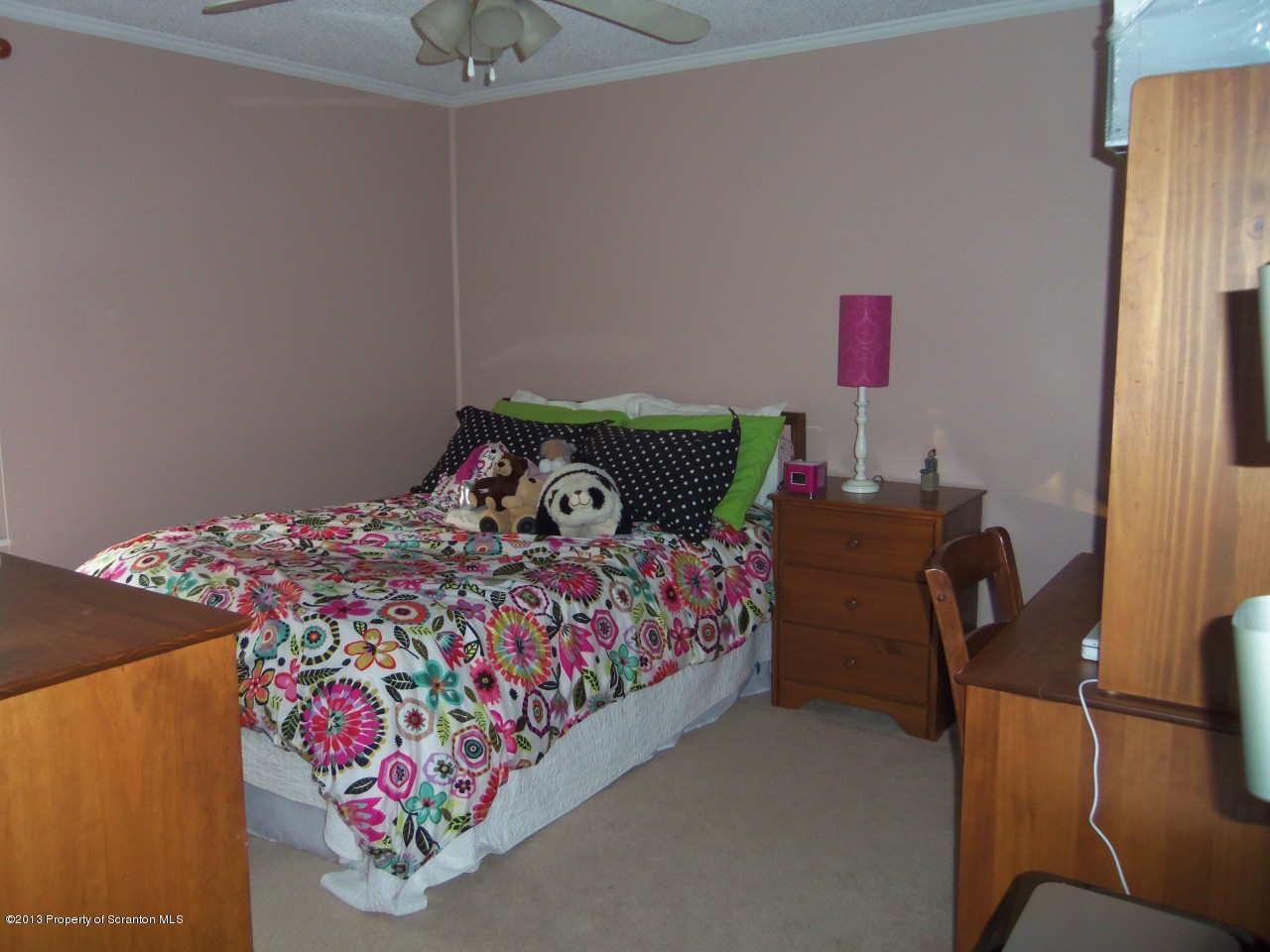 208 O'Hara Road Moscow, PA 18444 - Photo 11 of 32 a bed sitting in a bedroom next to a lamp