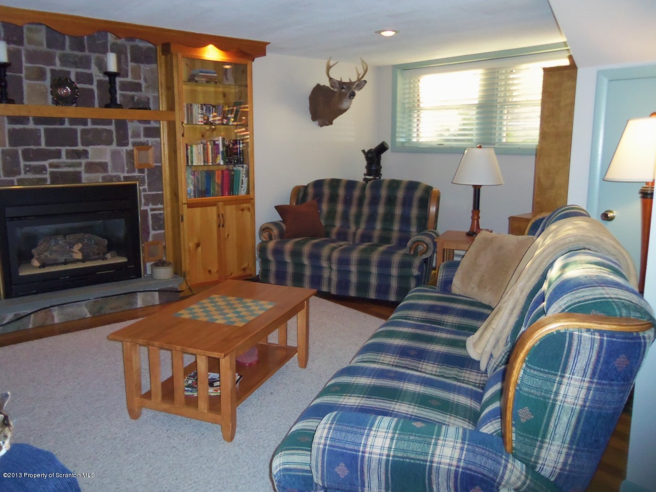 208 O'Hara Road Moscow, PA 18444 - Photo 14 of 32 a living room with furniture and a fireplace