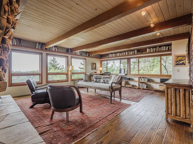 a kitchen with stainless steel appliances a refrigerator and wooden floor