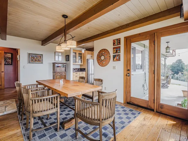 a kitchen with cabinets and wooden floor