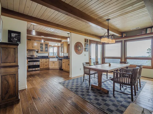 a view of a two chairs and table in the patio