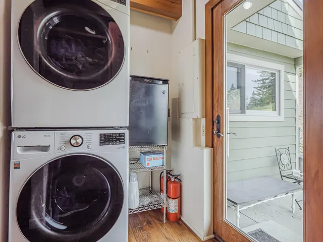 a view of a livingroom with furniture and a window