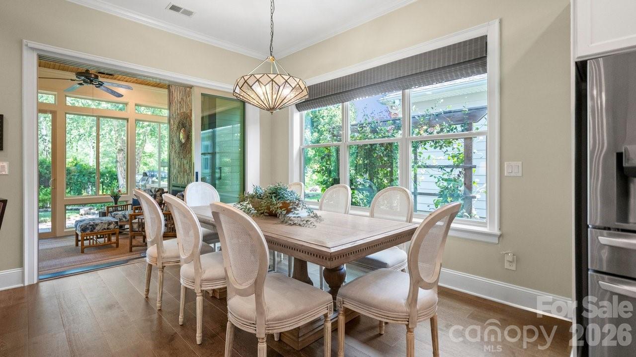 4854 Looking Glass Trail Denver, NC 28037 - Photo 18 of 48 a view of a dining room with furniture wooden floor and chandelier
