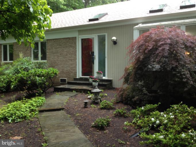 11245 Handlebar Road Reston, VA 20191 - Photo 1 of 27 a front view of a house with garden