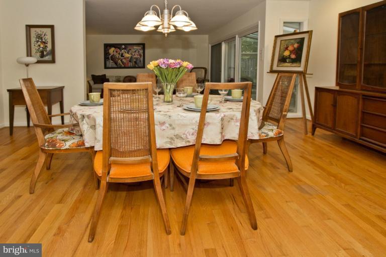 11245 Handlebar Road Reston, VA 20191 - Photo 2 of 27 a view of a dining room with furniture and chandelier