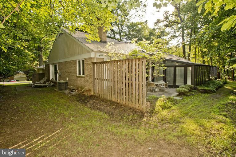 11245 Handlebar Road Reston, VA 20191 - Photo 12 of 27 a backyard of a house with table and chairs