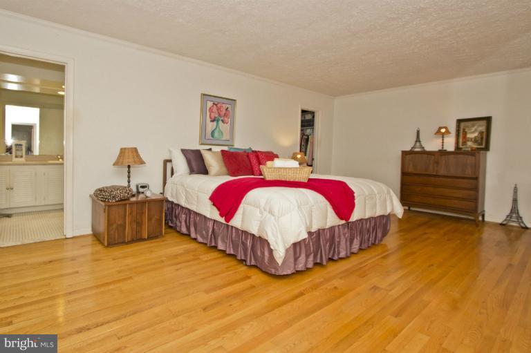 11245 Handlebar Road Reston, VA 20191 - Photo 15 of 27 a bedroom with a bed and dresser