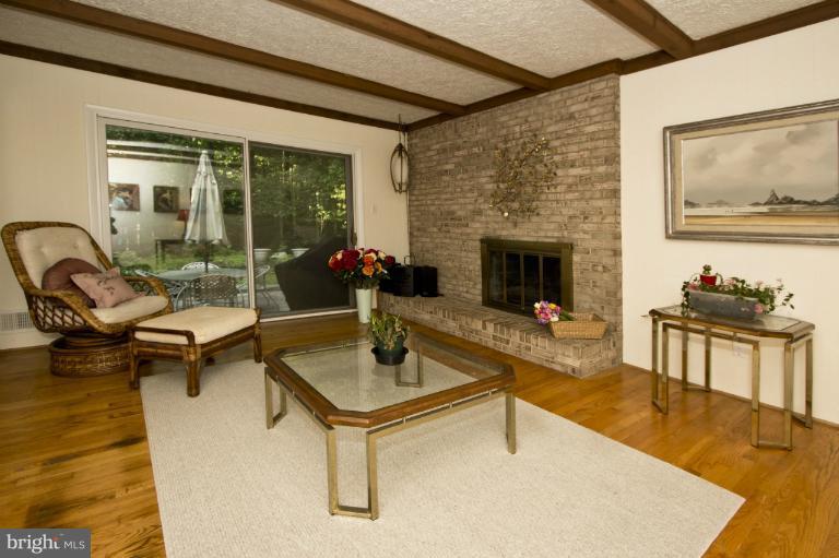 11245 Handlebar Road Reston, VA 20191 - Photo 3 of 27 a living room with furniture and a fireplace