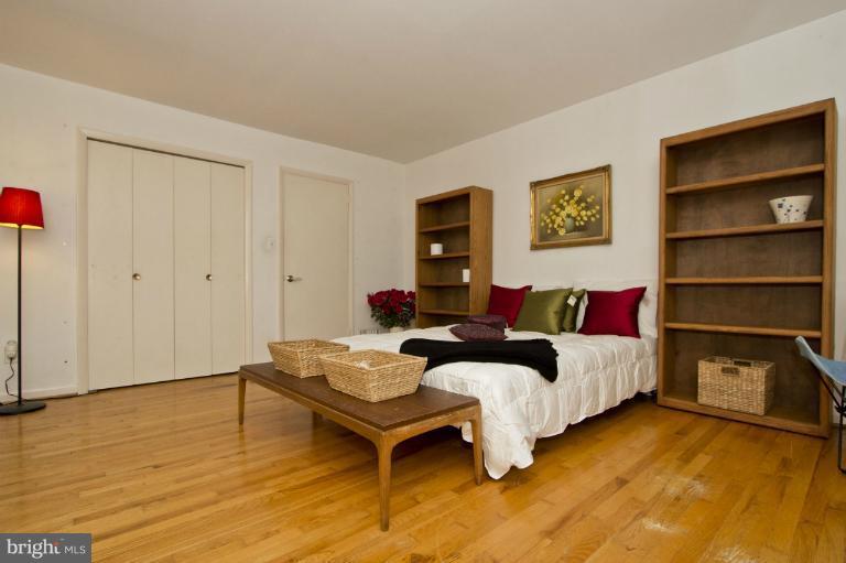 11245 Handlebar Road Reston, VA 20191 - Photo 21 of 27 a bedroom with a bed and a dresser