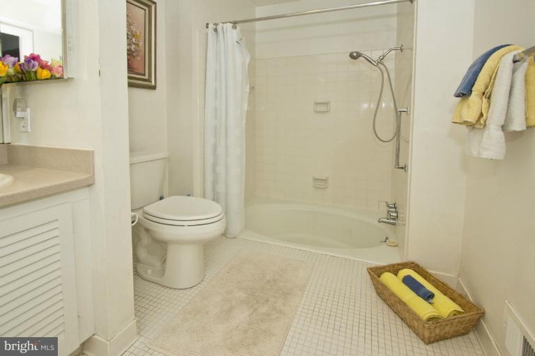 11245 Handlebar Road Reston, VA 20191 - Photo 4 of 27 a bathroom with a shower and a toilet