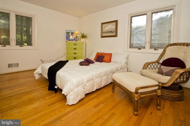 11245 Handlebar Road Reston, VA 20191 - Photo 5 of 27 a bedroom with a bed and a window