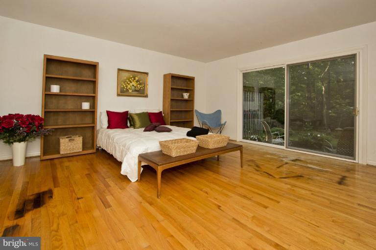 11245 Handlebar Road Reston, VA 20191 - Photo 6 of 27 a living room with furniture and a floor to ceiling window
