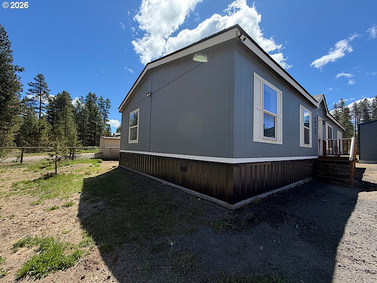 16125 Hawks Lair Road La Pine, OR 97739 - Photo 25 of 35 a view of an house with backyard space and balcony
