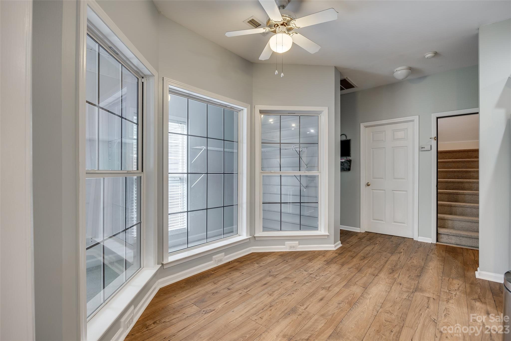 1028 Needles Drive Lancaster, SC 29720 - Photo 11 of 34 wooden floor in an empty room with a window