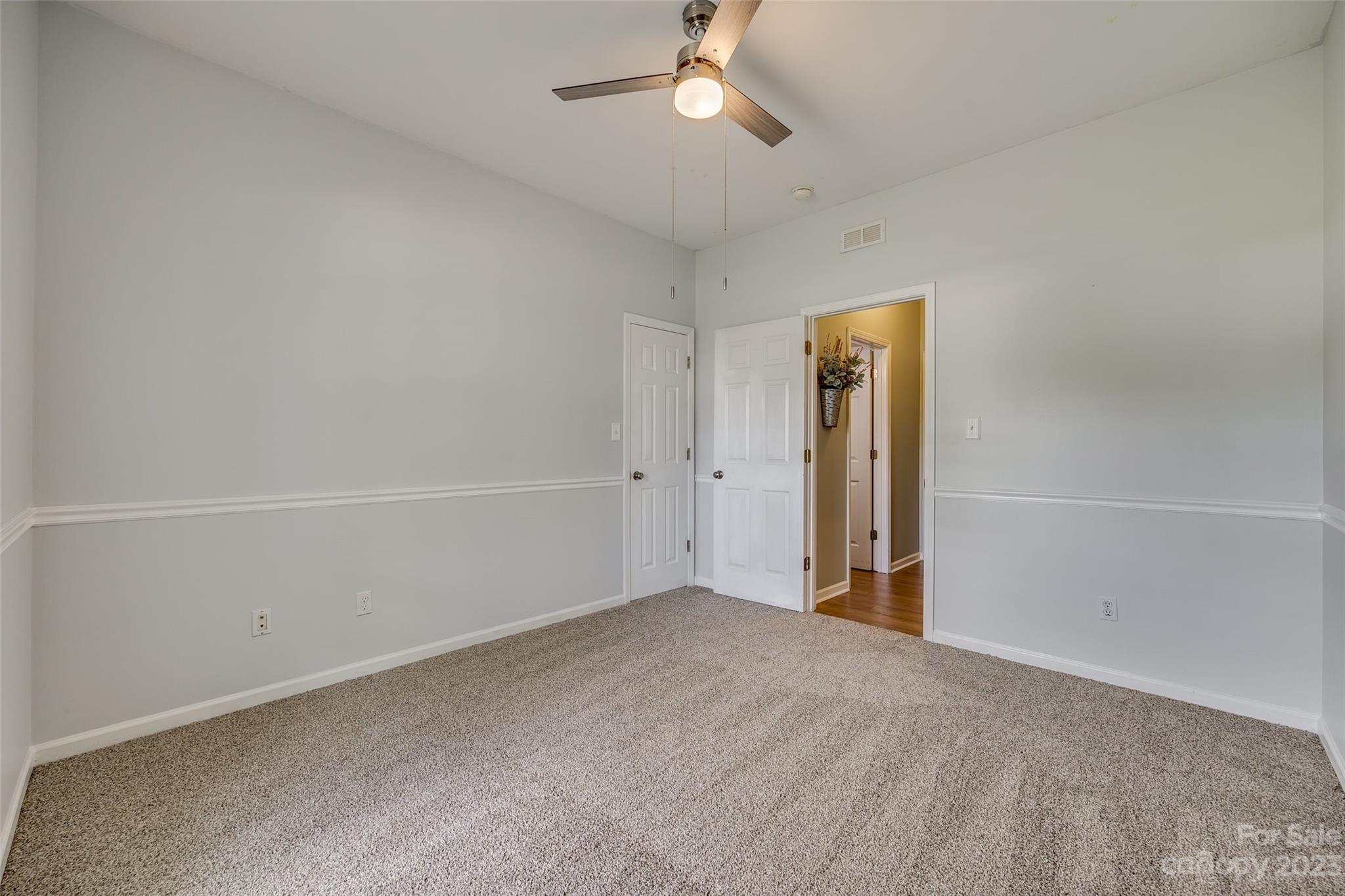 1028 Needles Drive Lancaster, SC 29720 - Photo 20 of 34 an empty room with closet and windows