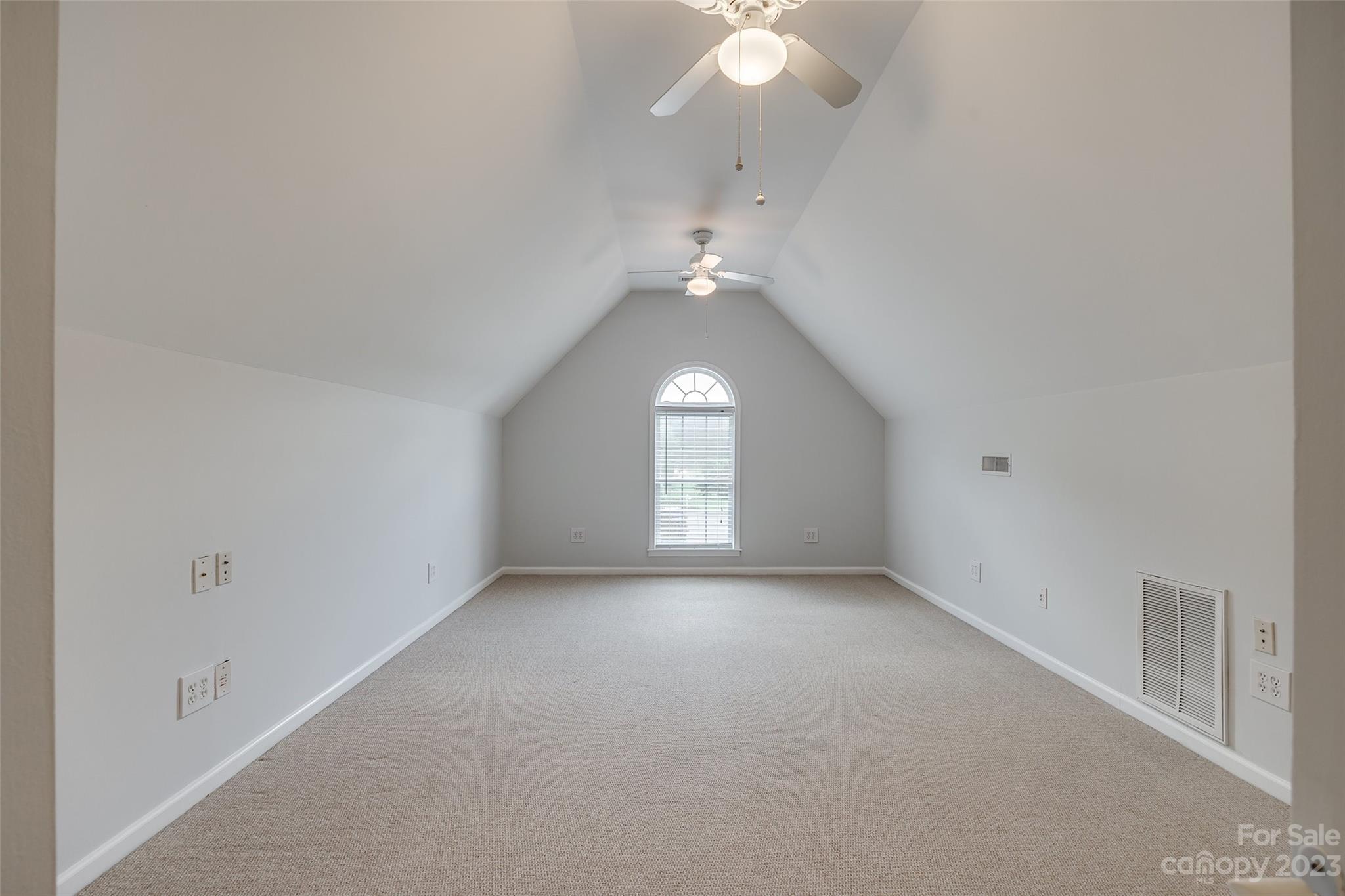 1028 Needles Drive Lancaster, SC 29720 - Photo 28 of 34 an empty room with a window and chandelier fan