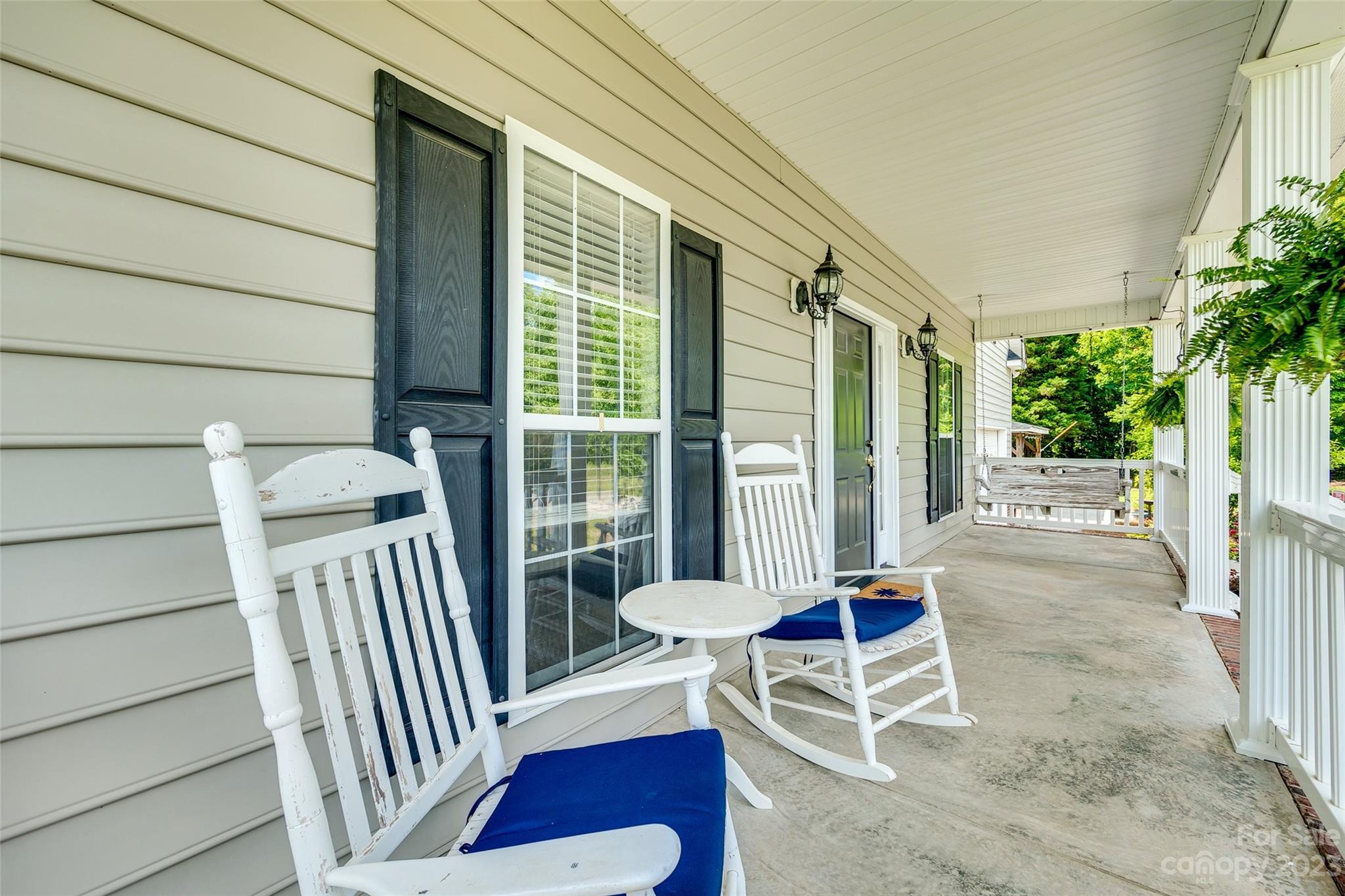1028 Needles Drive Lancaster, SC 29720 - Photo 3 of 34 a view of a porch with furniture and floor to ceiling window