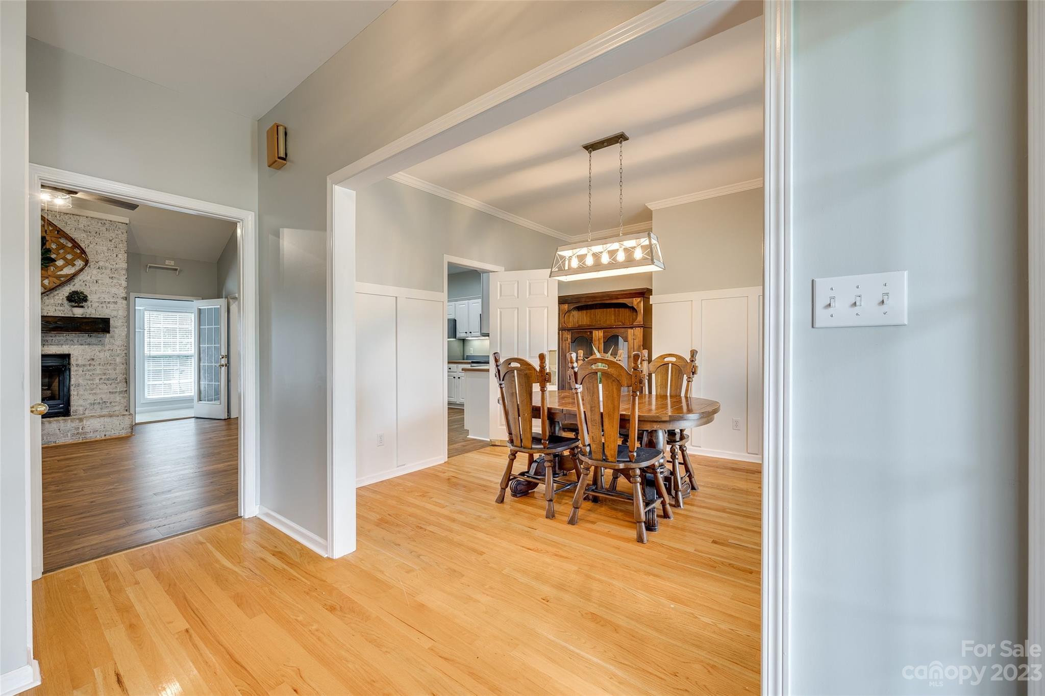 1028 Needles Drive Lancaster, SC 29720 - Photo 6 of 34 a view of a dining room with furniture and wooden floor