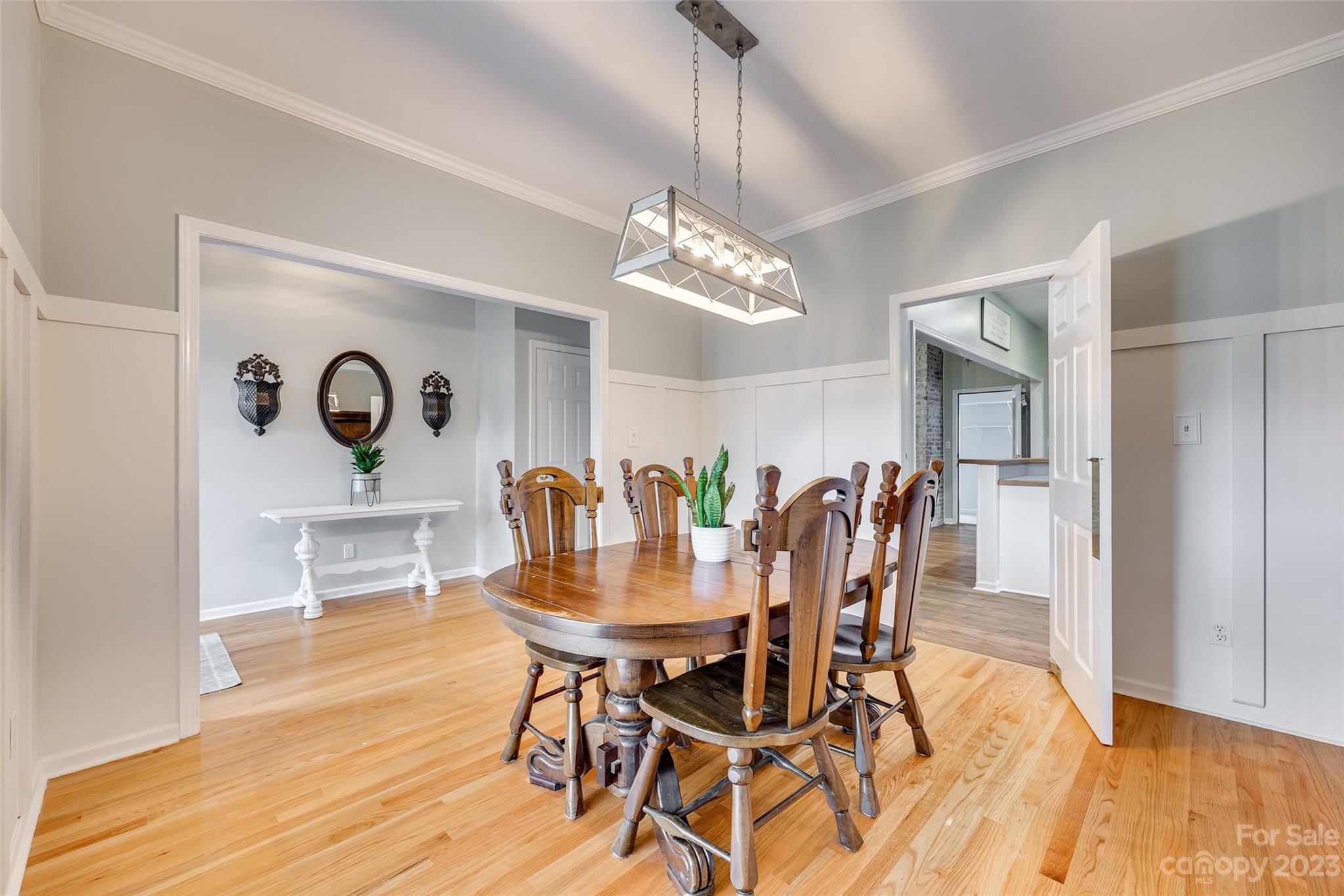 1028 Needles Drive Lancaster, SC 29720 - Photo 7 of 34 a view of a dining room with furniture and wooden floor