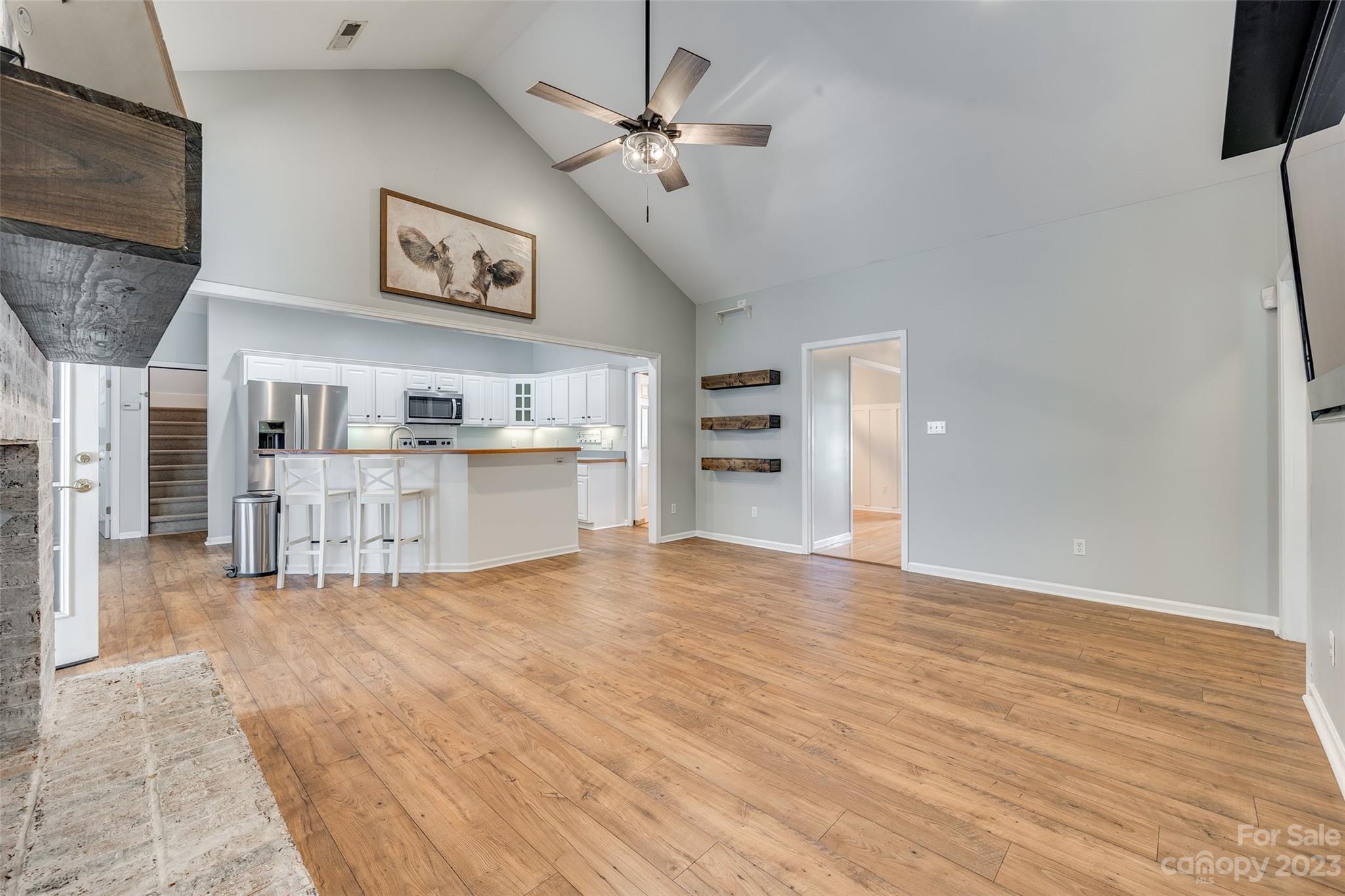 1028 Needles Drive Lancaster, SC 29720 - Photo 9 of 34 a view of a kitchen with furniture and wooden floor
