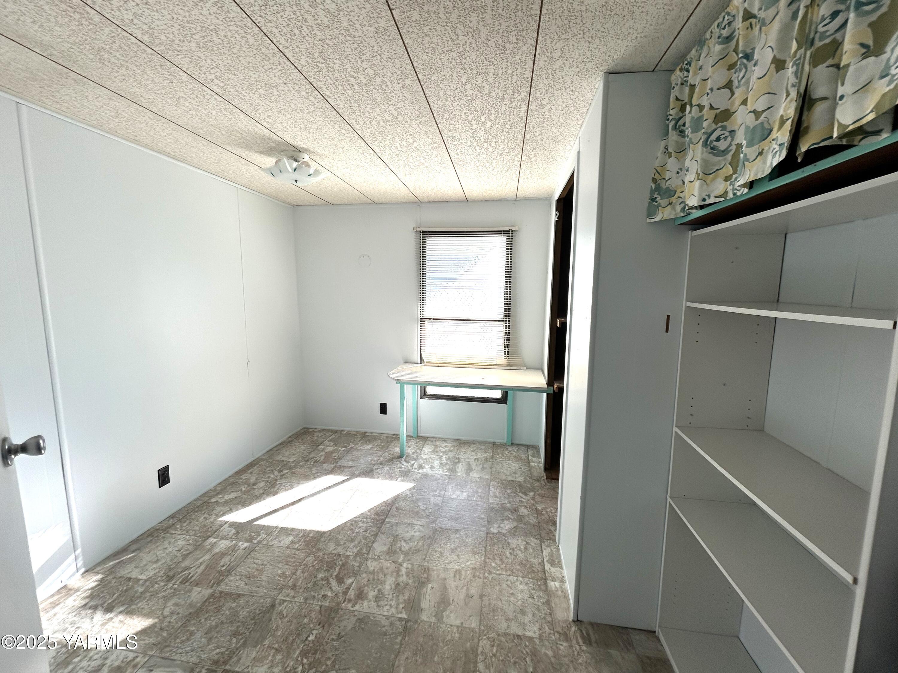 451 Pence Road, Unit 49 Yakima, WA 98908 - Photo 12 of 16 a view of a room with window and cabinet