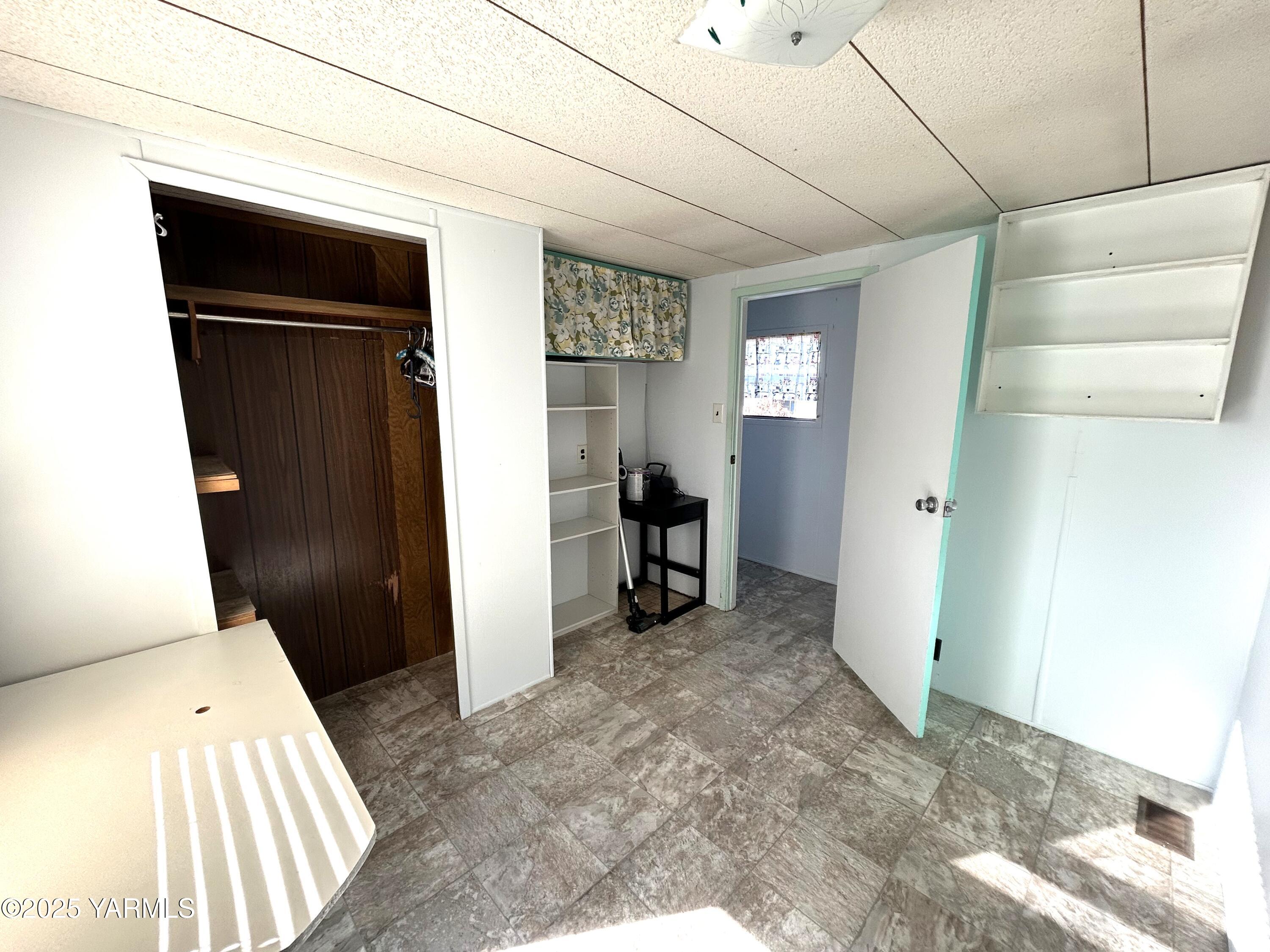 451 Pence Road, Unit 49 Yakima, WA 98908 - Photo 13 of 16 a view of a hallway to rooms and stairs