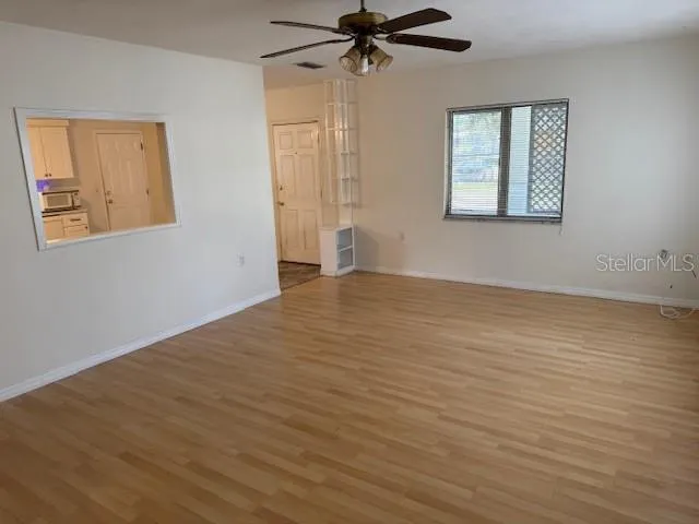 a view of an empty room with a window