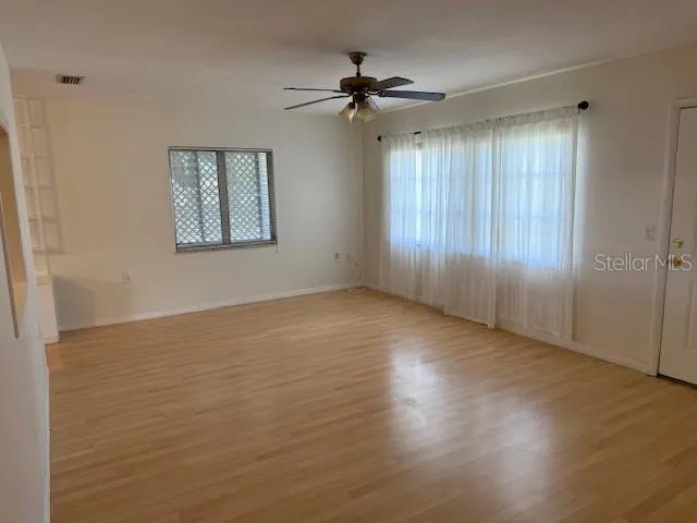 a view of an empty room with a window
