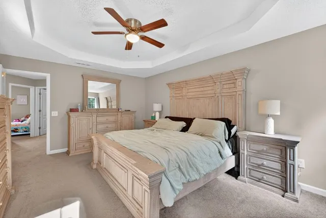 a bed room with a bed and a tv