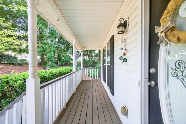 a view of a balcony with wooden floor