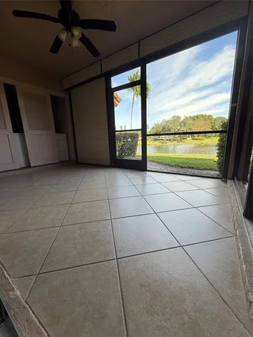 a view of a livingroom with furniture and an empty room