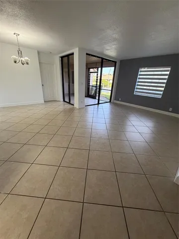 a view of an empty room and window