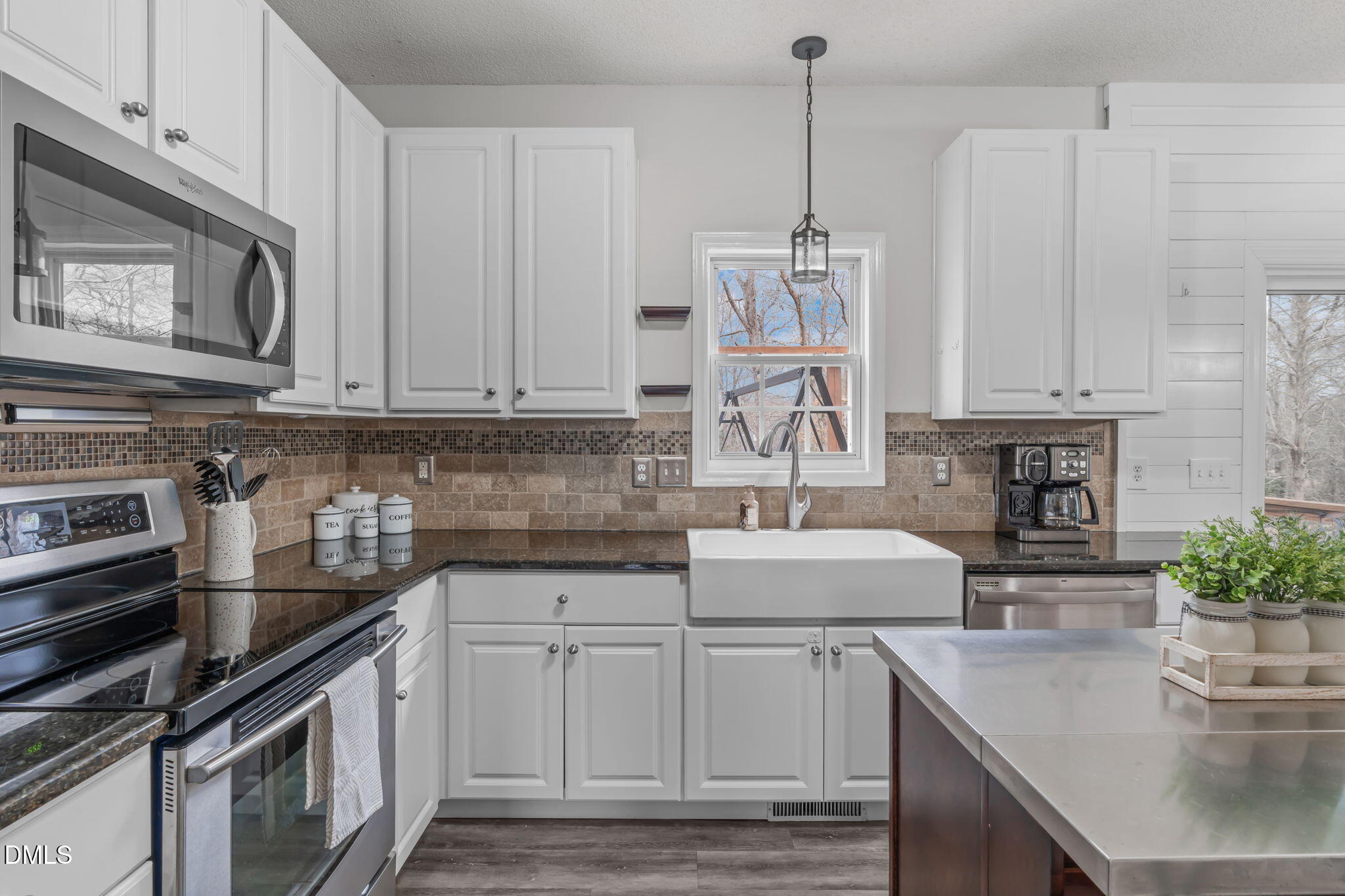 2501 Springfield Park Drive Raleigh, NC 27614 - Photo 13 of 44 a kitchen with stainless steel appliances granite countertop a sink stove and cabinets