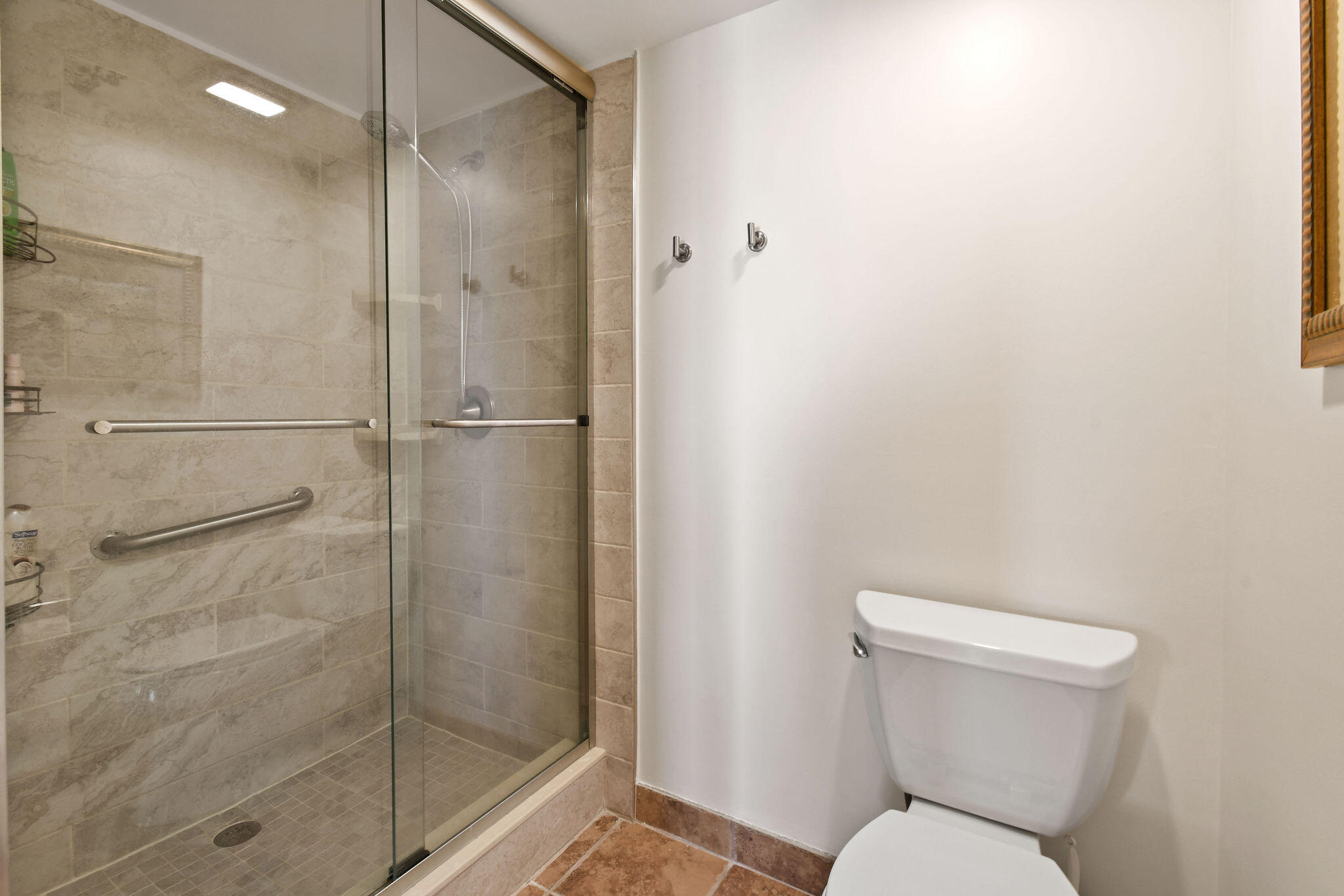 1601 Marina Isle Way, Unit 505 Jupiter, FL 33477 - Photo 12 of 23 a bathroom with a toilet and a shower