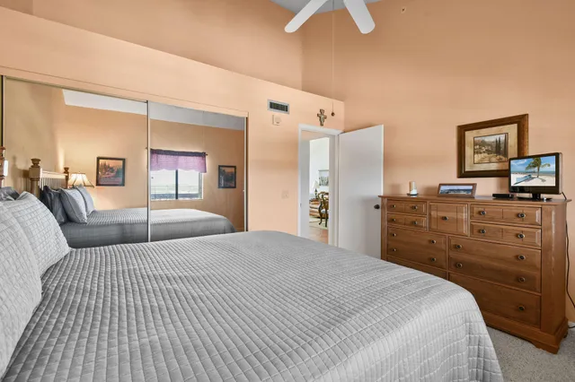 a bedroom with a bed and dresser