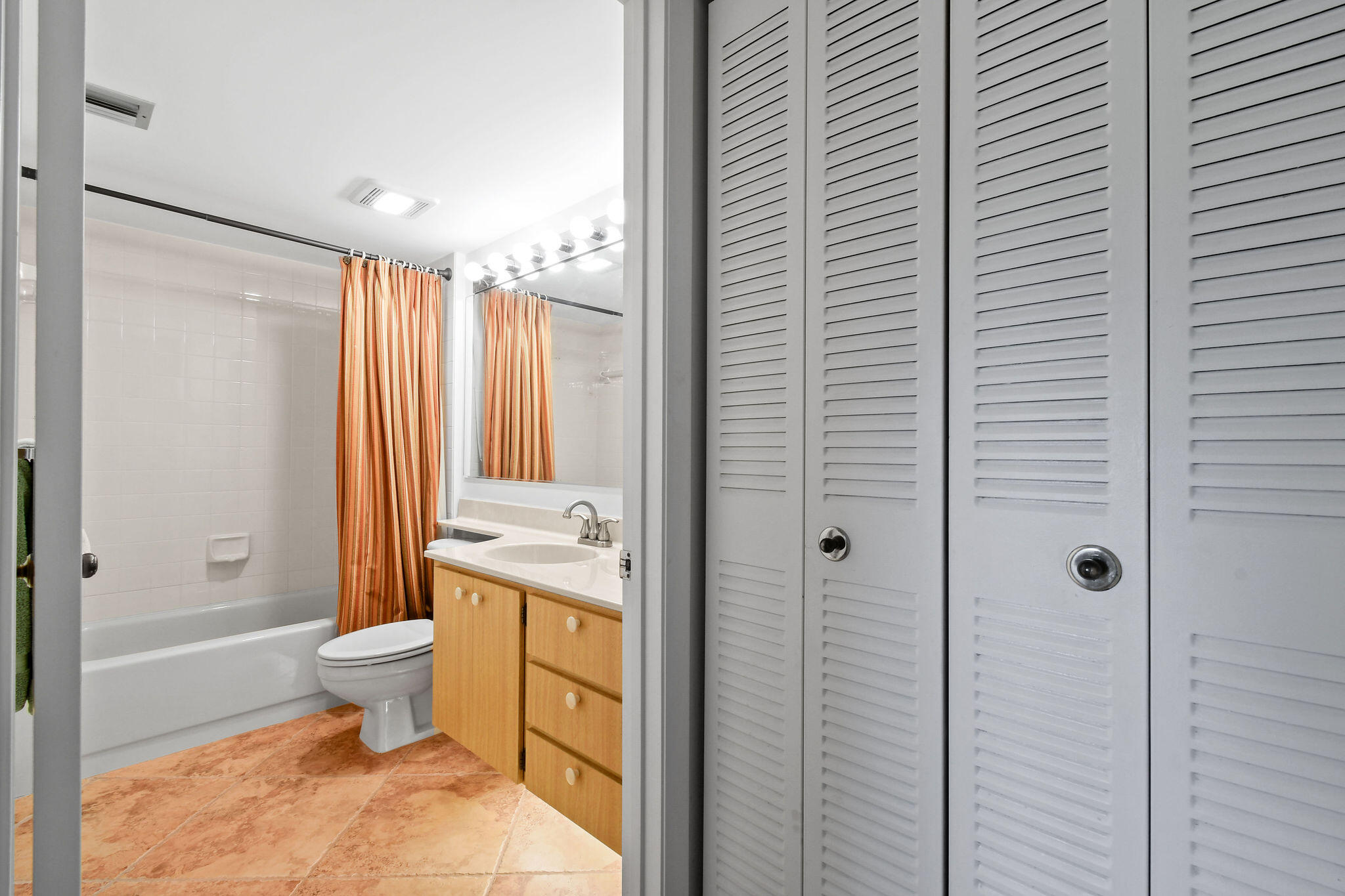 1601 Marina Isle Way, Unit 505 Jupiter, FL 33477 - Photo 16 of 23 a bathroom with a toilet a sink and shower