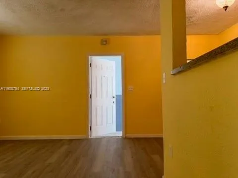 a view of door with wooden floor