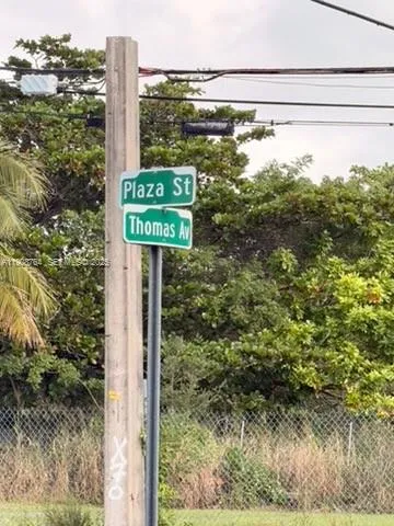 a view of a back yard from a balcony