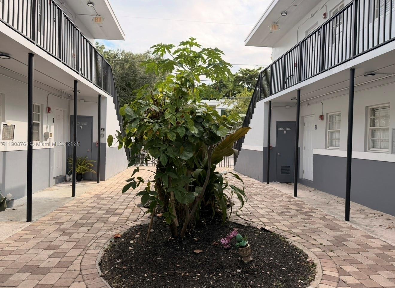 3615 Thomas Avenue, Unit 3 Miami, FL 33133 - Photo 2 of 6 a view of a house with a yard